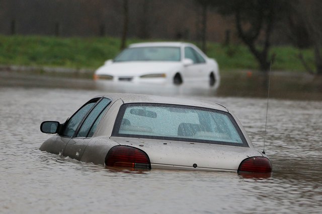 Vehicles submerged in flood waters during the winter storm in Petaluma, California,
