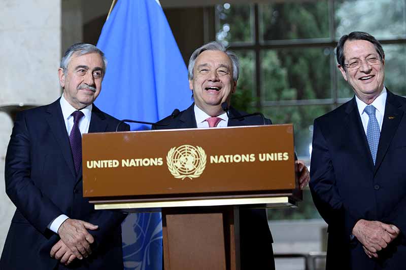 UN Secretary-General Antonio Guterres (centre) speaks next to Greek Cypriot President Nicos Anastasiades (right) and Turkish Cypriot leader Mustafa Akinci during a press conference in Geneva
