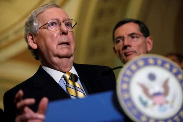 Mitch McConnell freezes at press conference and is escorted away