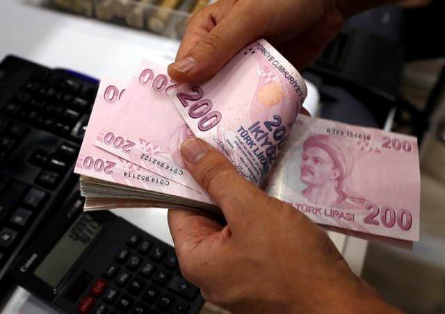 File Photo A Money Changer Counts Turkish Lira Banknotes At File Photo A Money Changer Counts Turkish Lira Banknotes At Currency Exchange Office In Istanbul