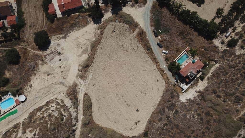 Aerial view of Debbie's house on the right before pool filled in. A huge fissure runs through field