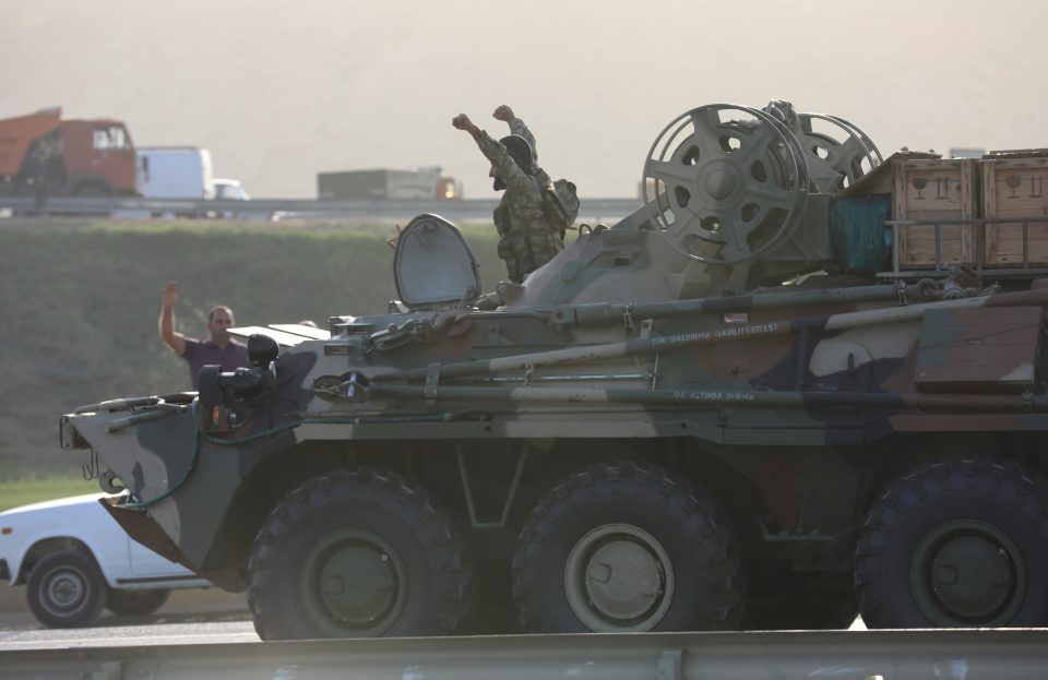 An Azerbaijani Service Member Drives An Armoured Carrier In Baku