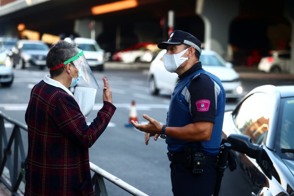 Local Police Officers Check Documents At A Traffic Control Point, In Madrid