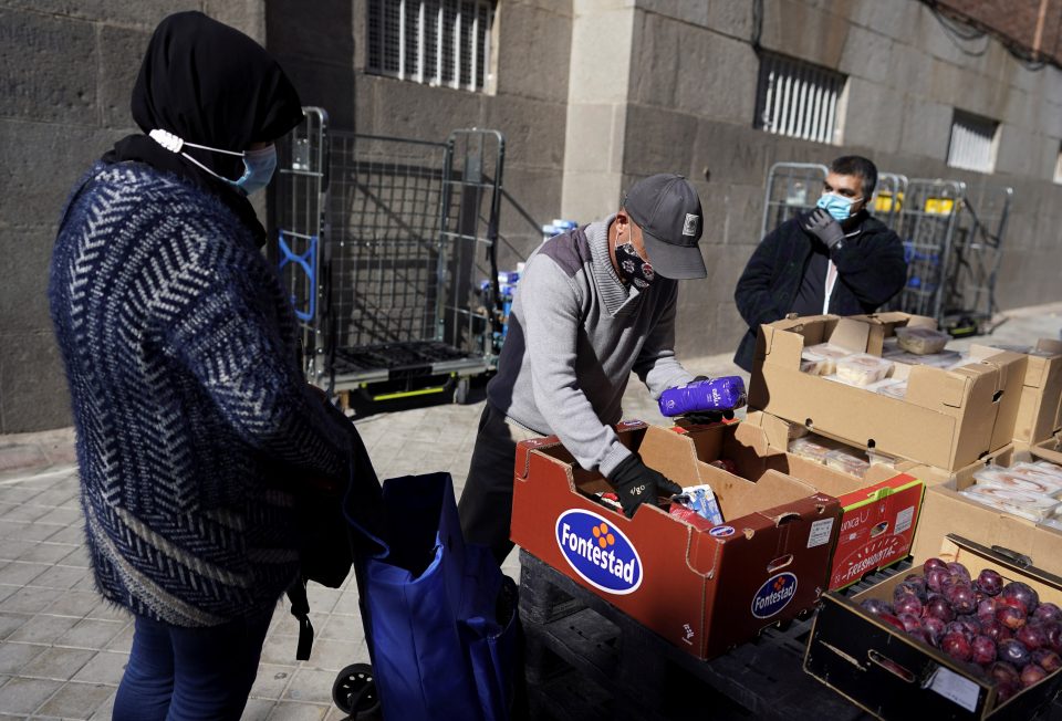 Members Of Ngo Madrina Foundation Serve Vulnerable People By Distributing Food, In Madrid