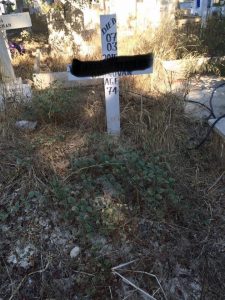 A Picture Of A Grave Before It Has Been Tidied By Louise And Lefteris