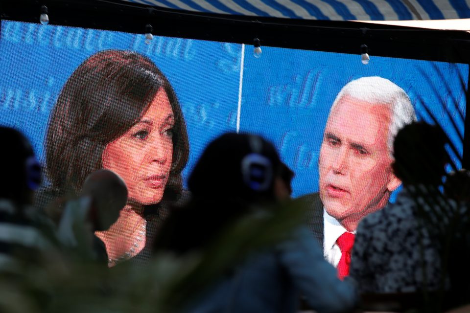 People Watch The Debate Between U.s. Vice President Mike Pence And Democratic Vice Presidential Nominee Kamala Harris Outside A Tavern In San Diego