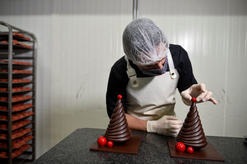A Worker Prepares A Pastry At The Workshop Of Belgian Chocolate Maker Marcolini, In Brussels