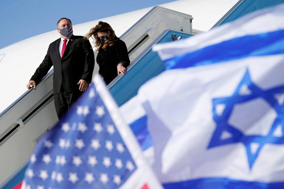 U.s. Secretary Of State Mike Pompeo And His Wife Susan Are Seen Past American And Israeli Flags As They Step Off A Plane At Ben Gurion International Airport Near Tel Aviv