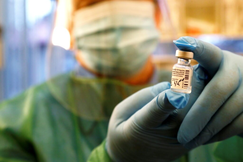 Medical Worker Holds Pfizer/biontech Covid 19 vaccine at The Hospital In Ventspils