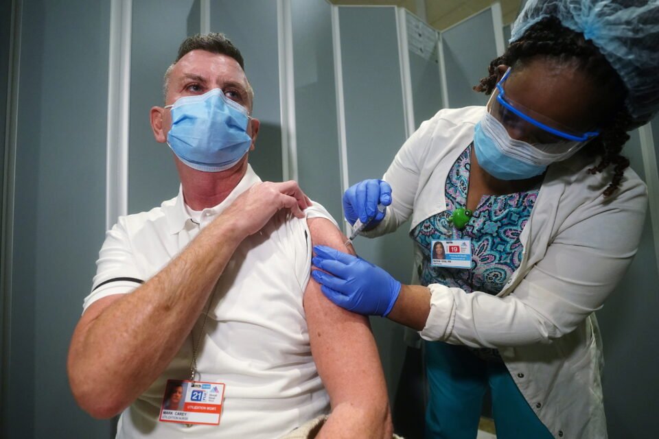 Nurse Mark Carey Receives One Of The First Vaccinations At Mt. Sinai Hospital From Pfizer Biontech, In New York