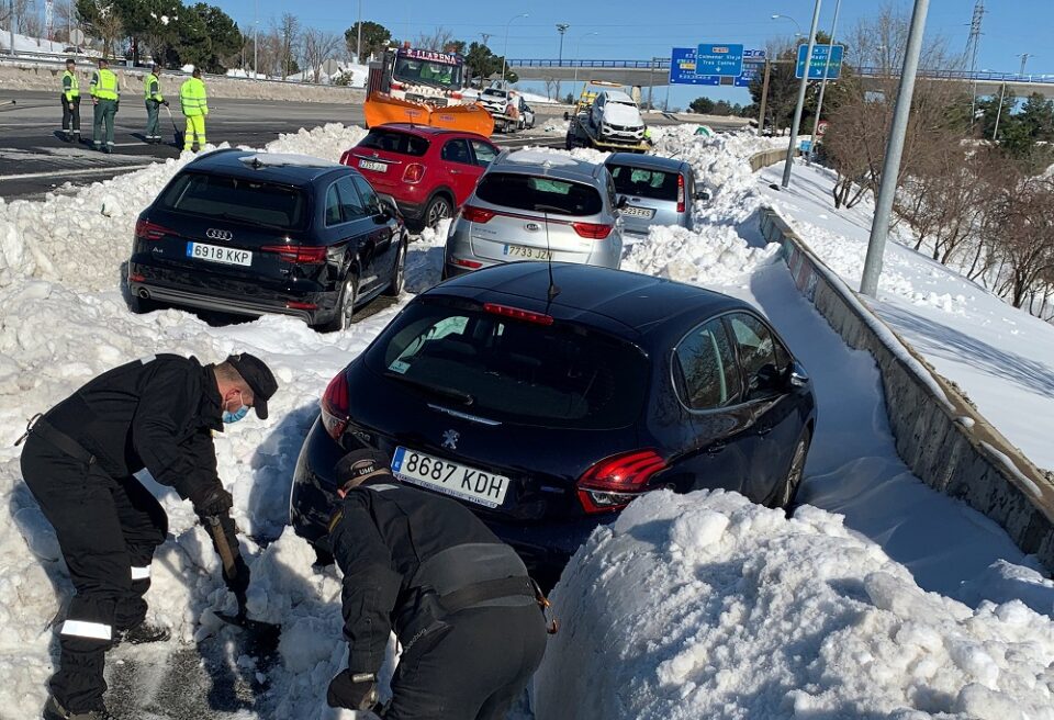 Members Of Spain's Military Unit (ume) Shovel Snow To Open A Pass Next To Cars Accumulated On M 40 Highway After Heavy Snowfall In Madrid