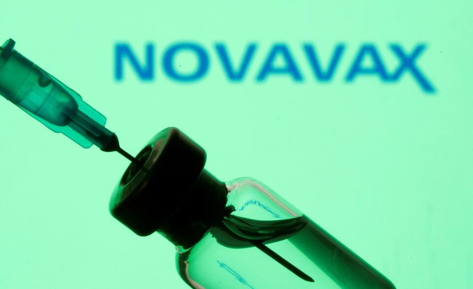 Vial And Sryinge Are Seen In Front Of Displayed Novavax Logo In This Illustration Taken