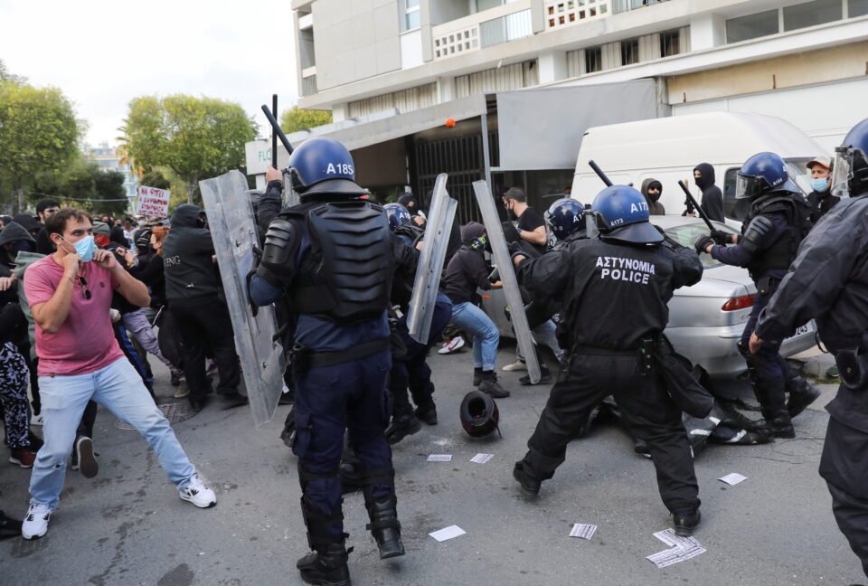 protesters and activists clash with riot police during a rally against corruption and covid 19 restriction measures, in nicosia