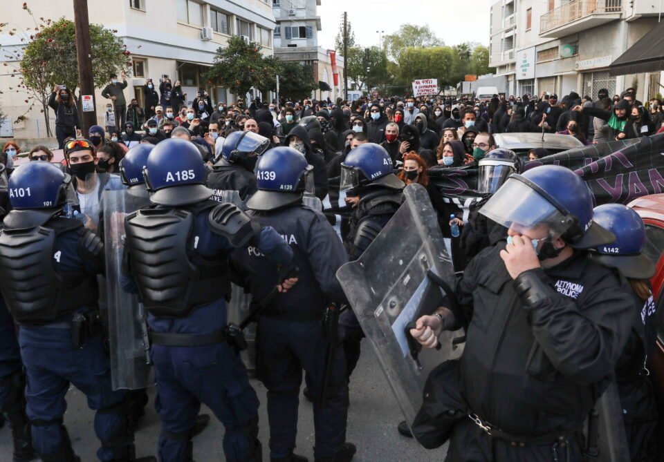 protesters and activists clash with riot police during a rally against corruption and covid 19 restriction measures, in nicosia