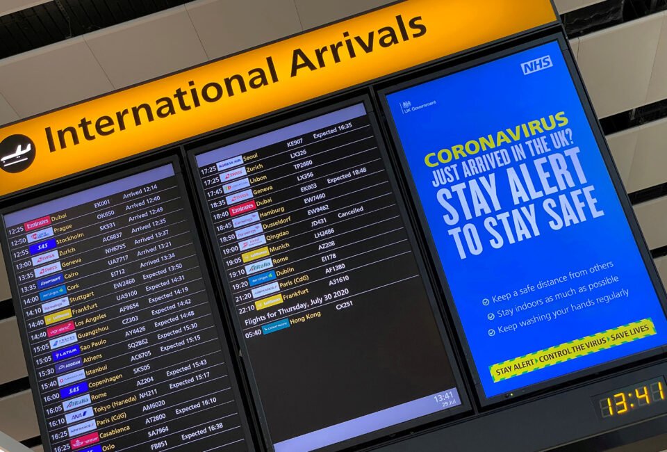 file photo: a public health campaign message is displayed on an arrivals information board at heathrow airport, following the outbreak of the coronavirus disease (covid 19), london, britain