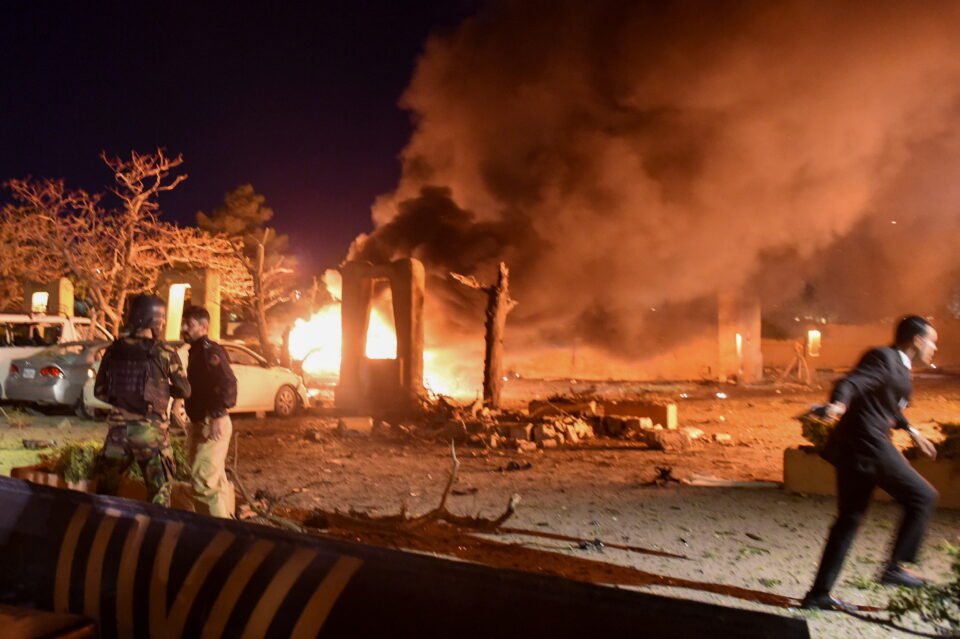 police and a paramilitary soldier are seen after an explosion at a luxury hotel in quetta