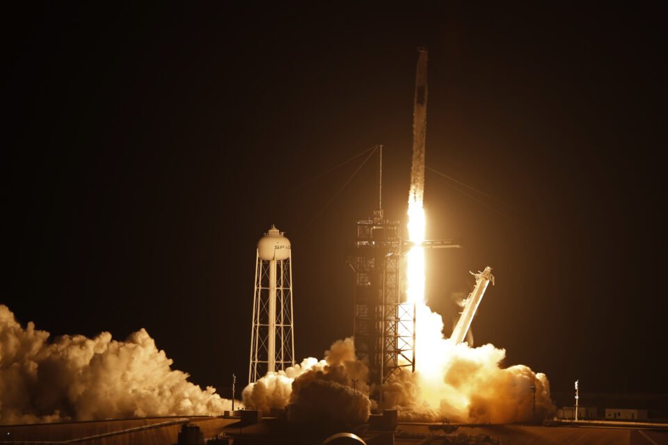 a spacex falcon 9 rocket, with the crew dragon capsule, carrying four astronauts on a nasa commercial crew mission, launches at the kennedy space center