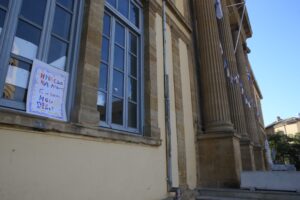 feature nick a student's sign protesting the planned closure of phaneromeni school to turn it into an architecture school for the university of cyprus