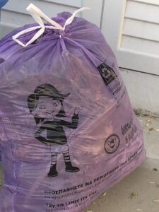 feature pay as you throw the designated purple bags must be purchased to dispose of rubbish