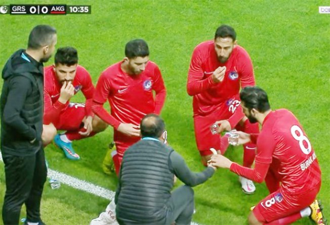 image Players break Ramadan fast on pitch during football match