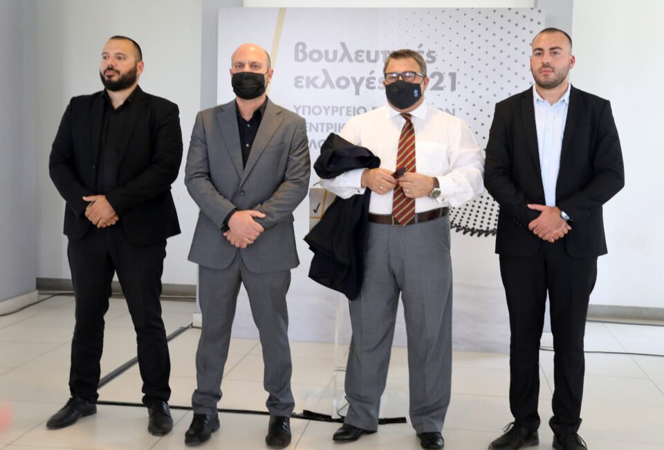 Themistocleous (second right) and other Elam officials during parliamentary elections