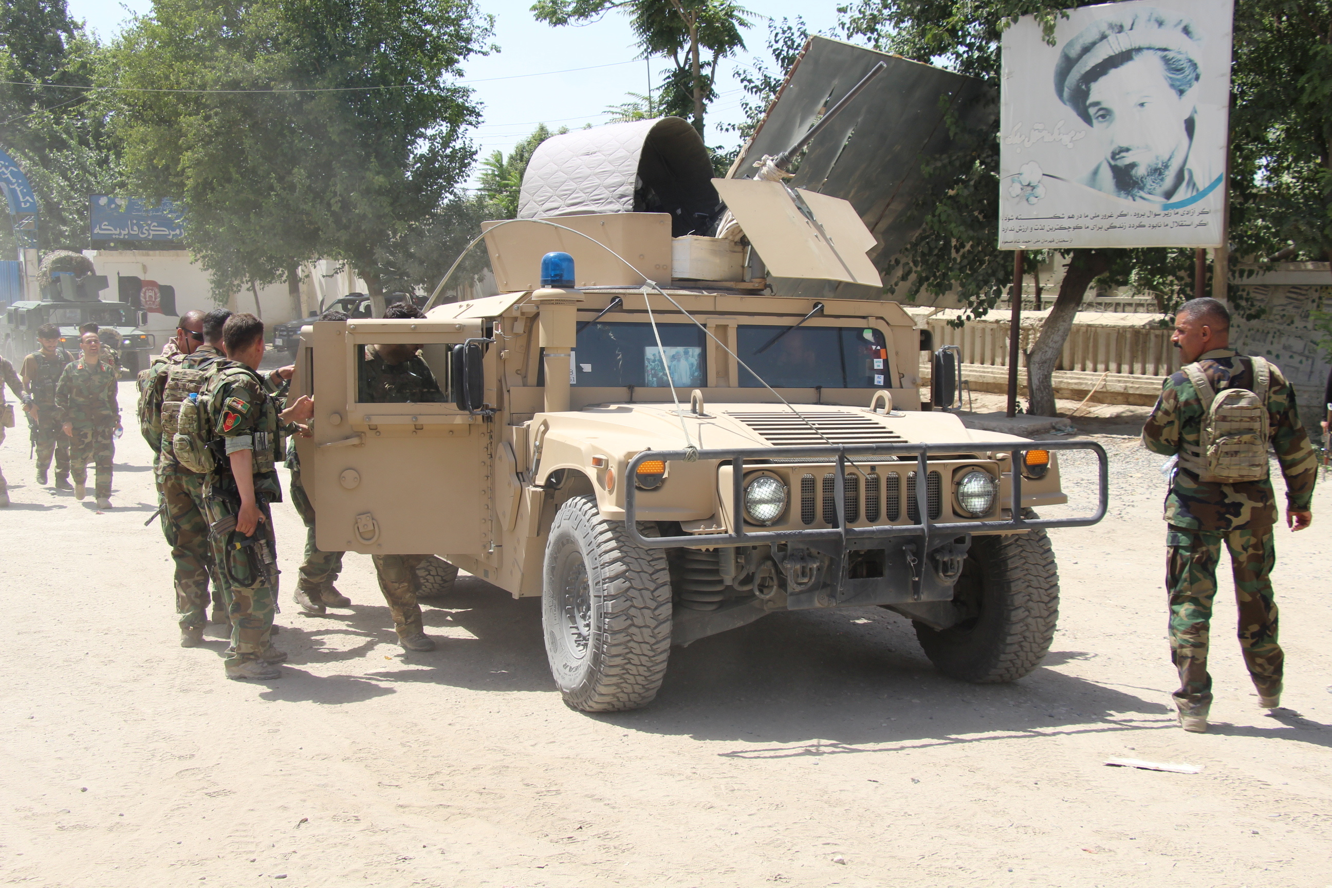 image Afghan hospital burns after attack; Taliban seize border post in north
