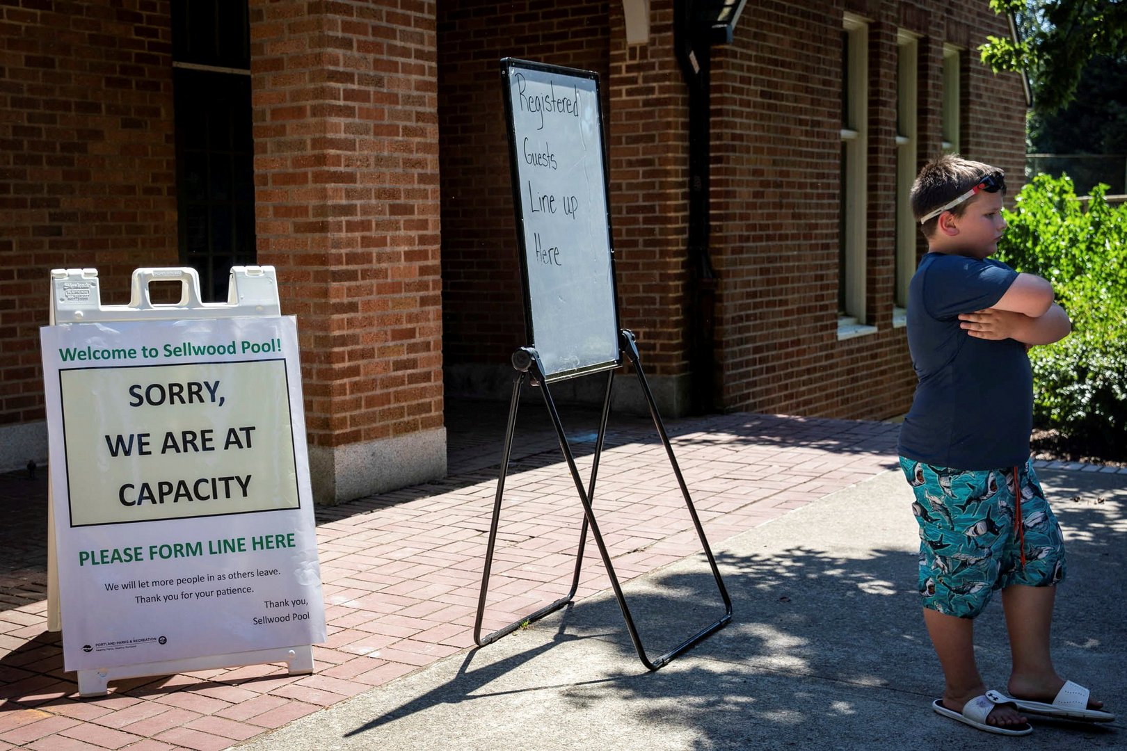file photo: long lines formed at public pools  during hot weather in portland