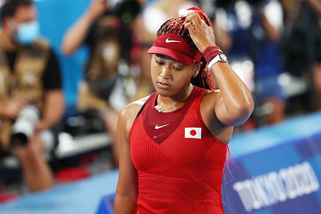 image Storm lurks over Tokyo, Osaka knocked out of Games