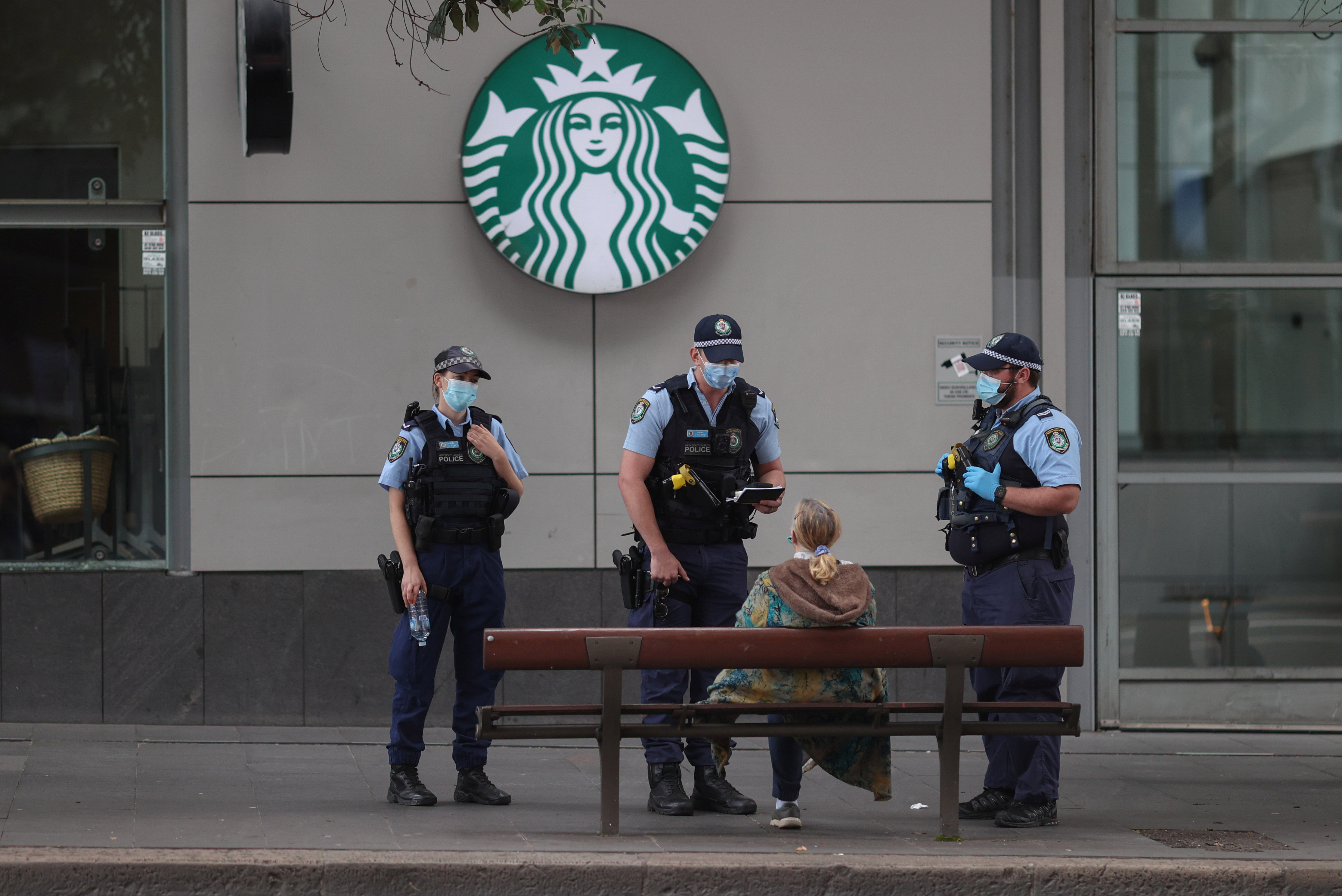 image Covid cases surge in Sydney as police cordon deters protest