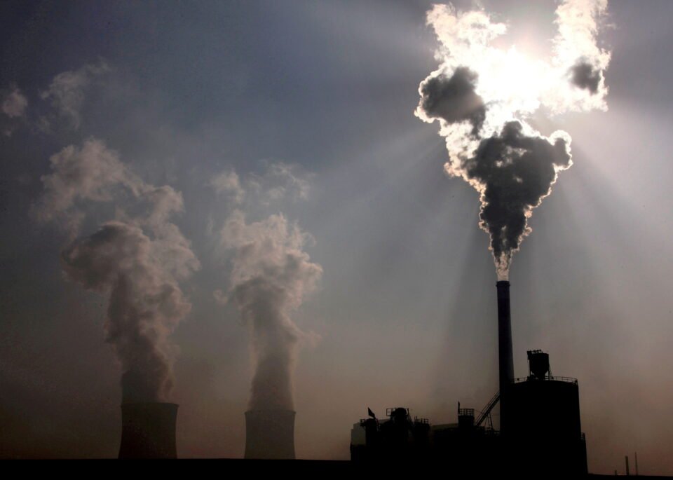file photo: a coal burning power plant can be seen behind a factory in china's inner mongolia autonomous region