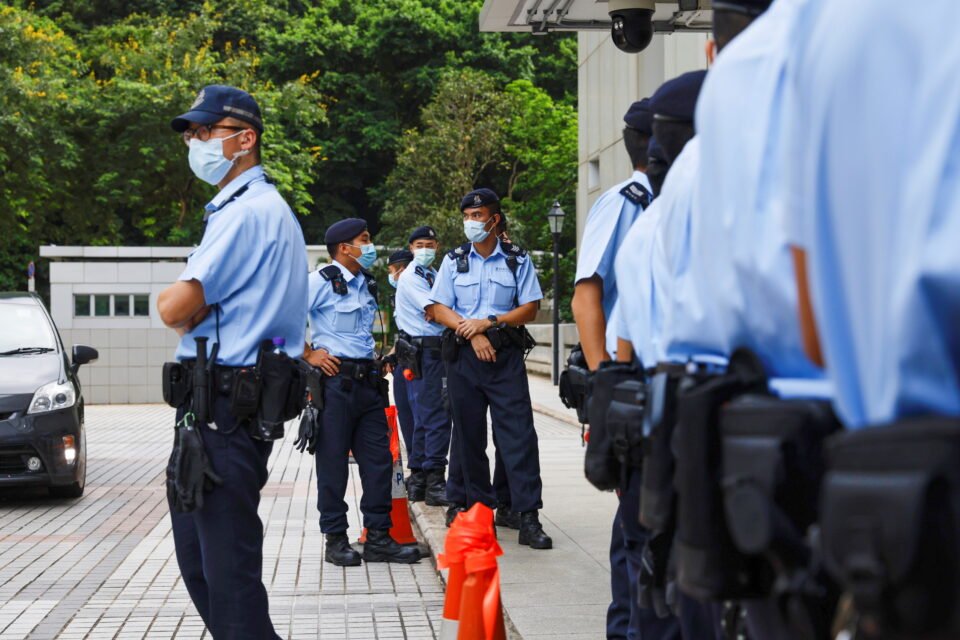police stand guard outside the high court during court hearing of tong ying kit, the first person charged under a new national security law, in hong kong
