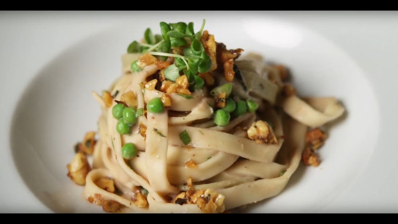 image White bean pasta Alfredo with peas and rosemary walnuts