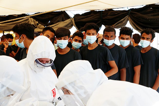 image Rescue ship carrying 257 migrants docks in Sicily port