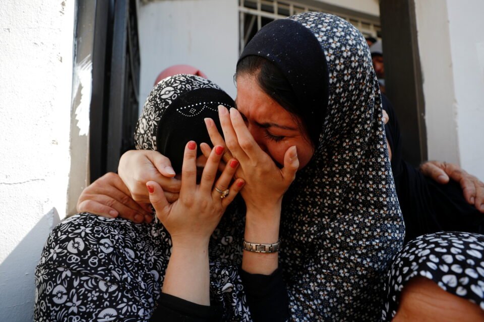 mourners react during the funeral of palestinian saleh ammar, in jenin