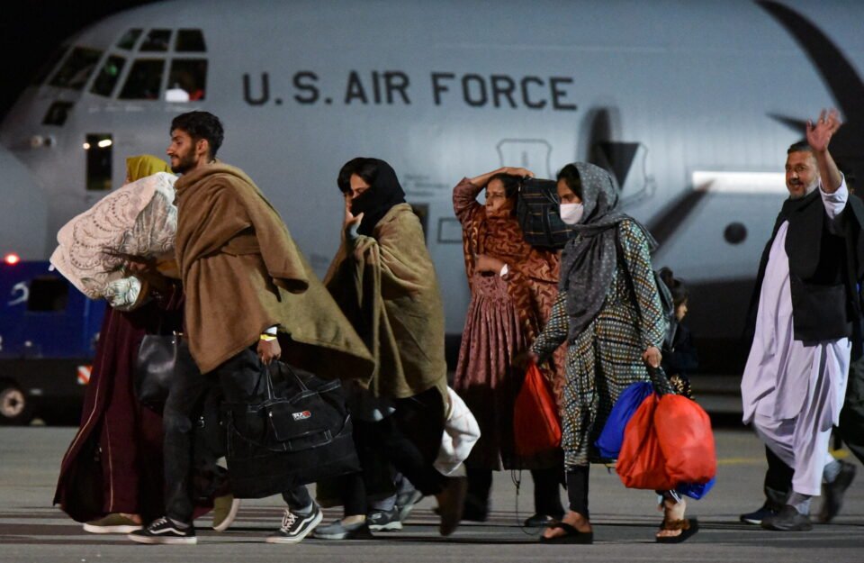 people who have been evacuated from afghanistan arrive at pristina international airport, in pristina