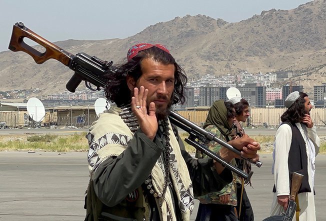 taliban forces patrol at a runway a day after u.s troops withdrawal from hamid karzai international airport in kabul