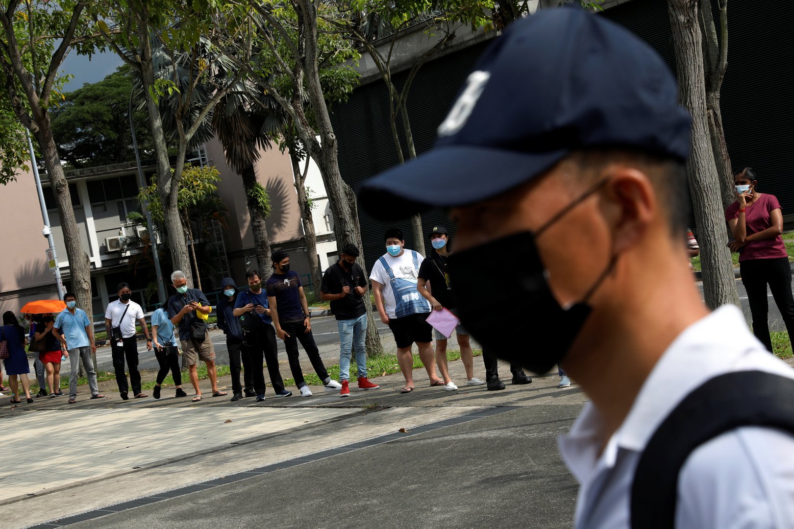 image Calls grow among experts in Singapore for a vaccine mandate as Covid -19 spikes
