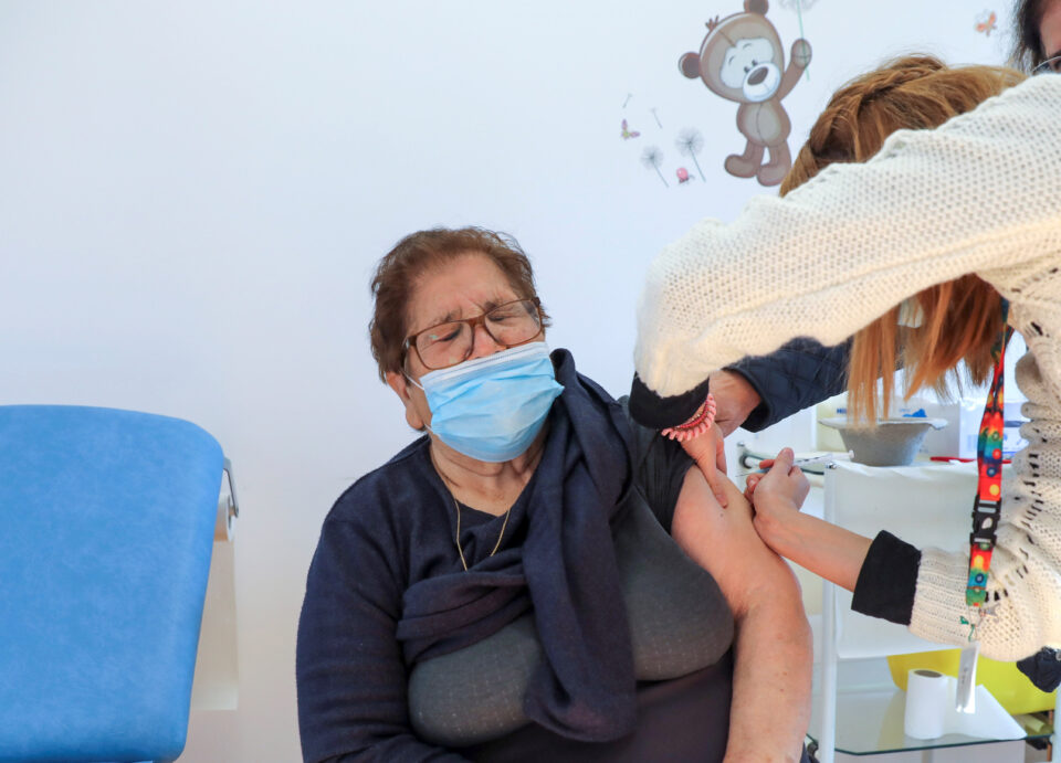 an elderly woman receives a vaccine against the coronavirus disease (covid 19) at the health centre of latsia in the capital nicosia