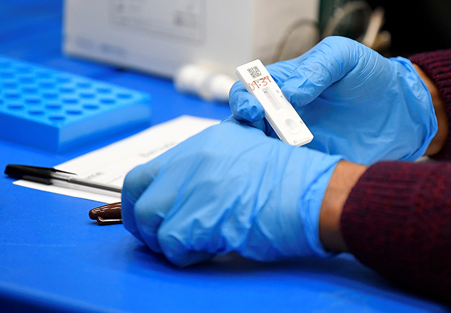 file photo: students take coronavirus disease (covid 19) tests at harris academy beckenham, in london
