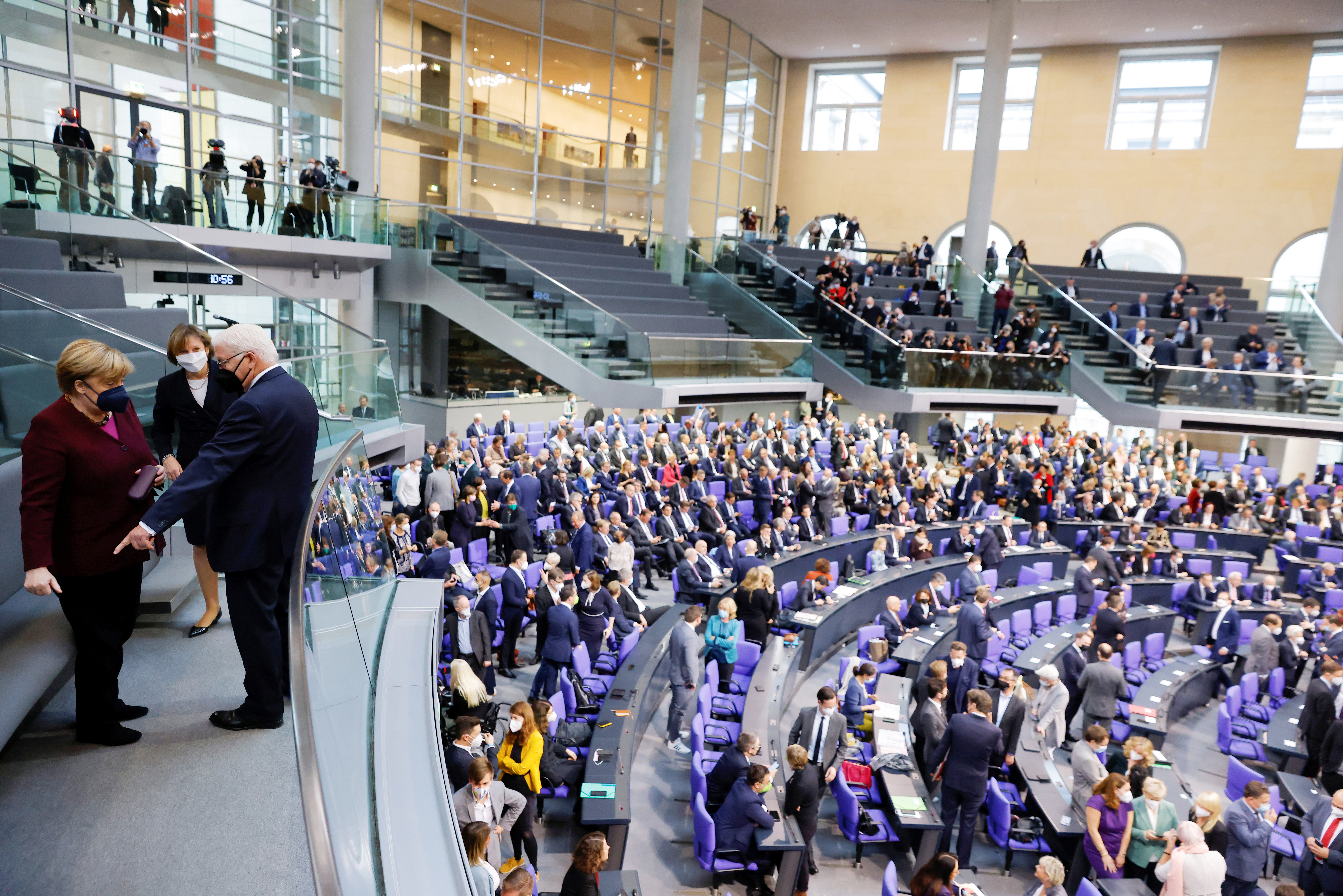 image Merkel looks on as new-era parliament convenes