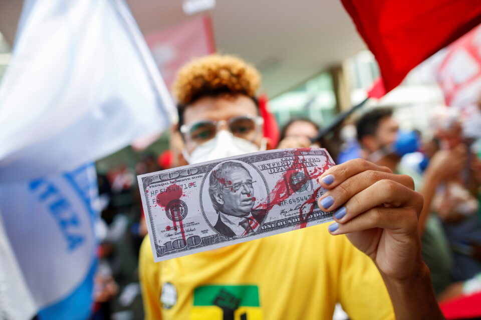 protest against brazil's economy minister paulo guedes and brazil's president jair bolsonaro next to the ministry of economy building in brasilia