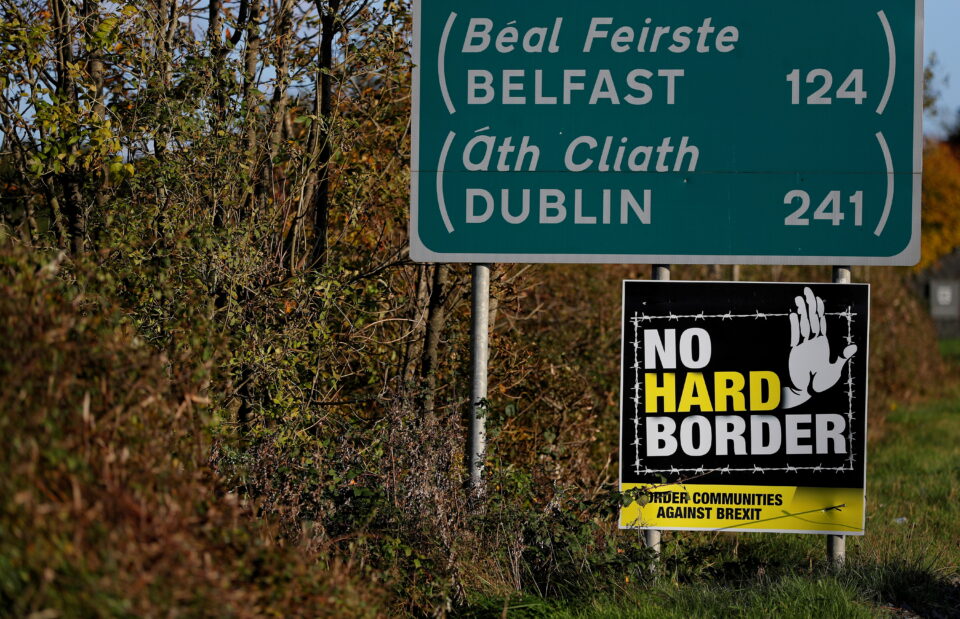 file photo: a 'no hard border' poster is seen below a road sign on the irish side of the border between ireland and northern ireland near bridgend