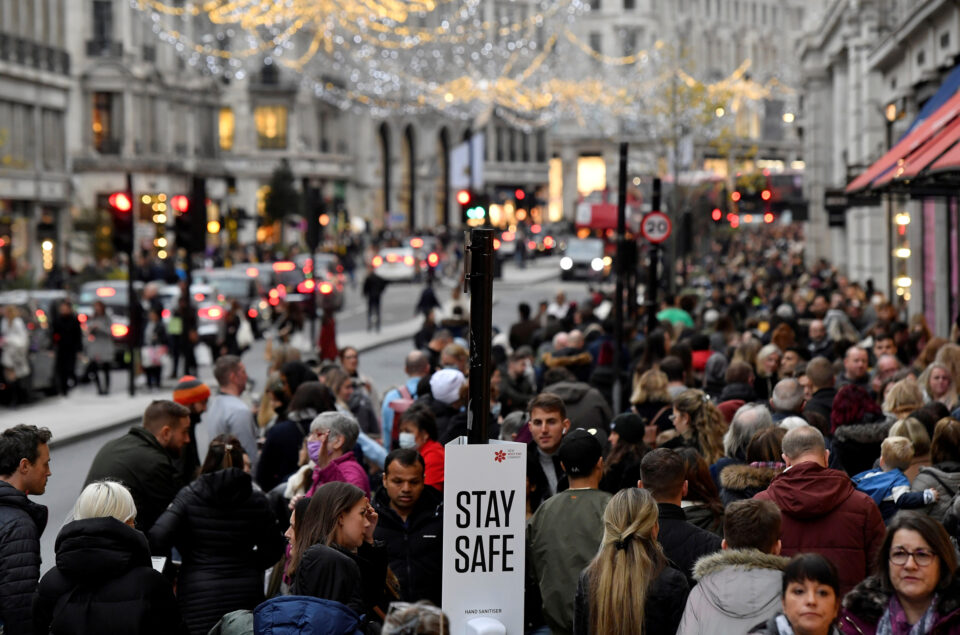 file photo: shoppers walk past a message on a hand sanitiser station amid the spread of the coronavirus disease (covid 19) pandemic, in regent street, london