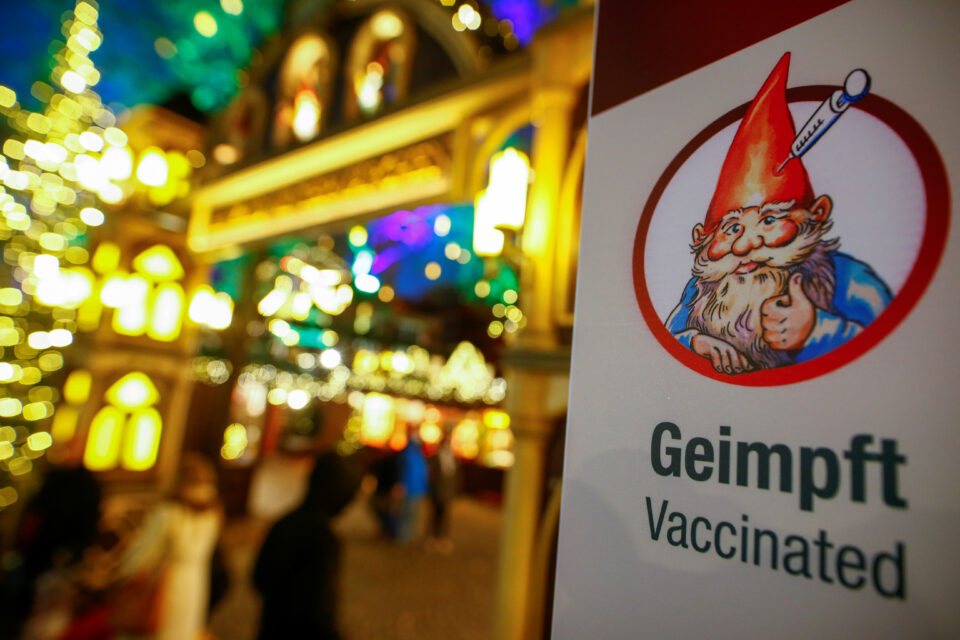 file photo: a sign about the '2g' rule, which allows only those vaccinated or recovered from the coronavirus disease (covid 19) to visit the christmas markets, is seen in cologne