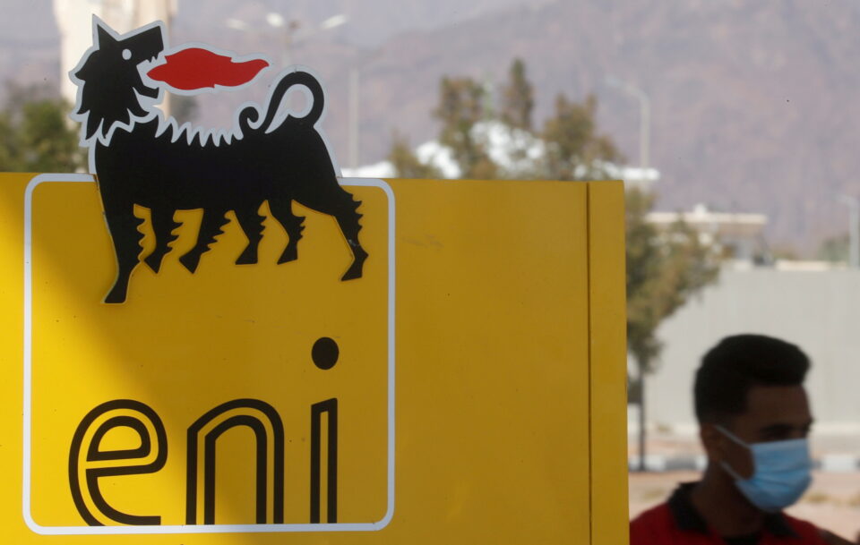 file photo: file photo: a man wearing a face mask walks near the sign of italian energy eni company at a gas station in the red sea resort of sharm el sheikh