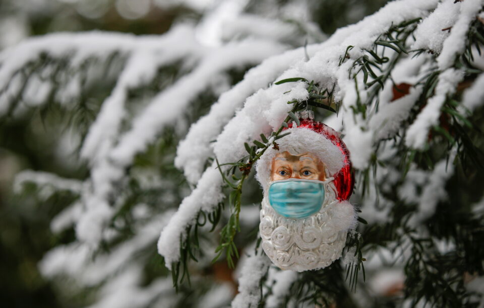 christmas bauble shaped as santa claus wearing protective mask is pictured in eichenau