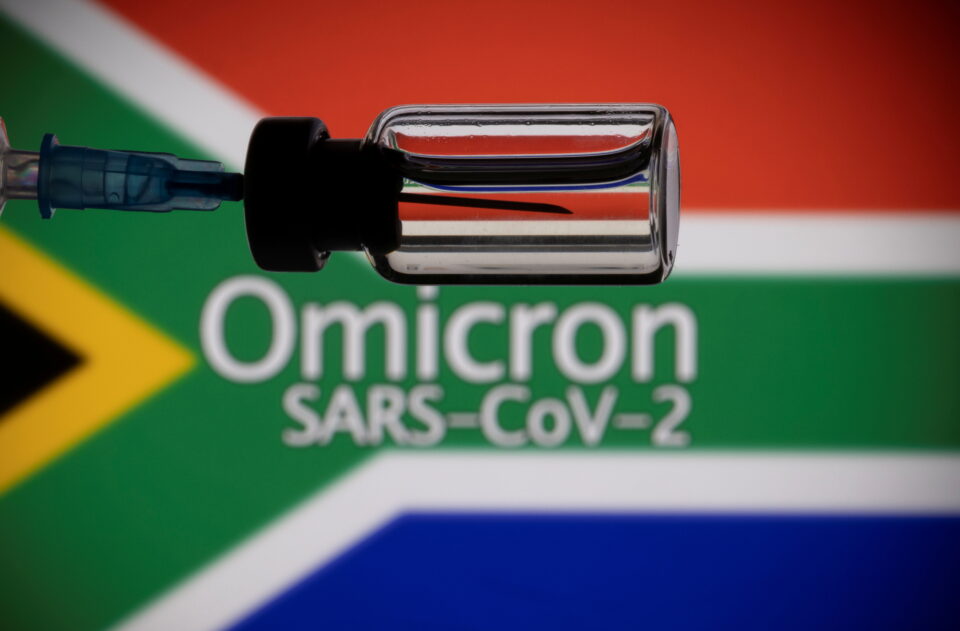 file photo: a vial and a syringe are seen in front of a displayed south africa flag and words "omicron sars cov 2" in this illustration taken