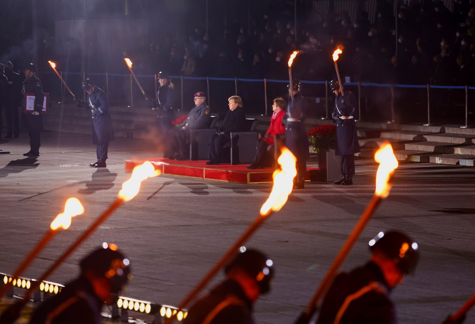 image With God, roses and punk, German military honours Merkel