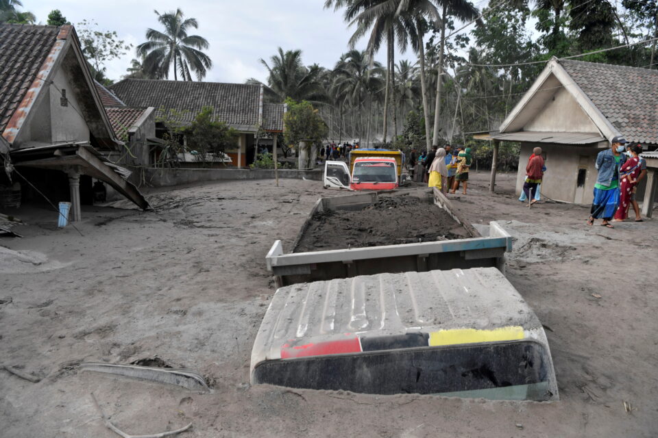 trucks covered by volcanic ash which is spewed out of mount semeru are see in sumber wuluh village