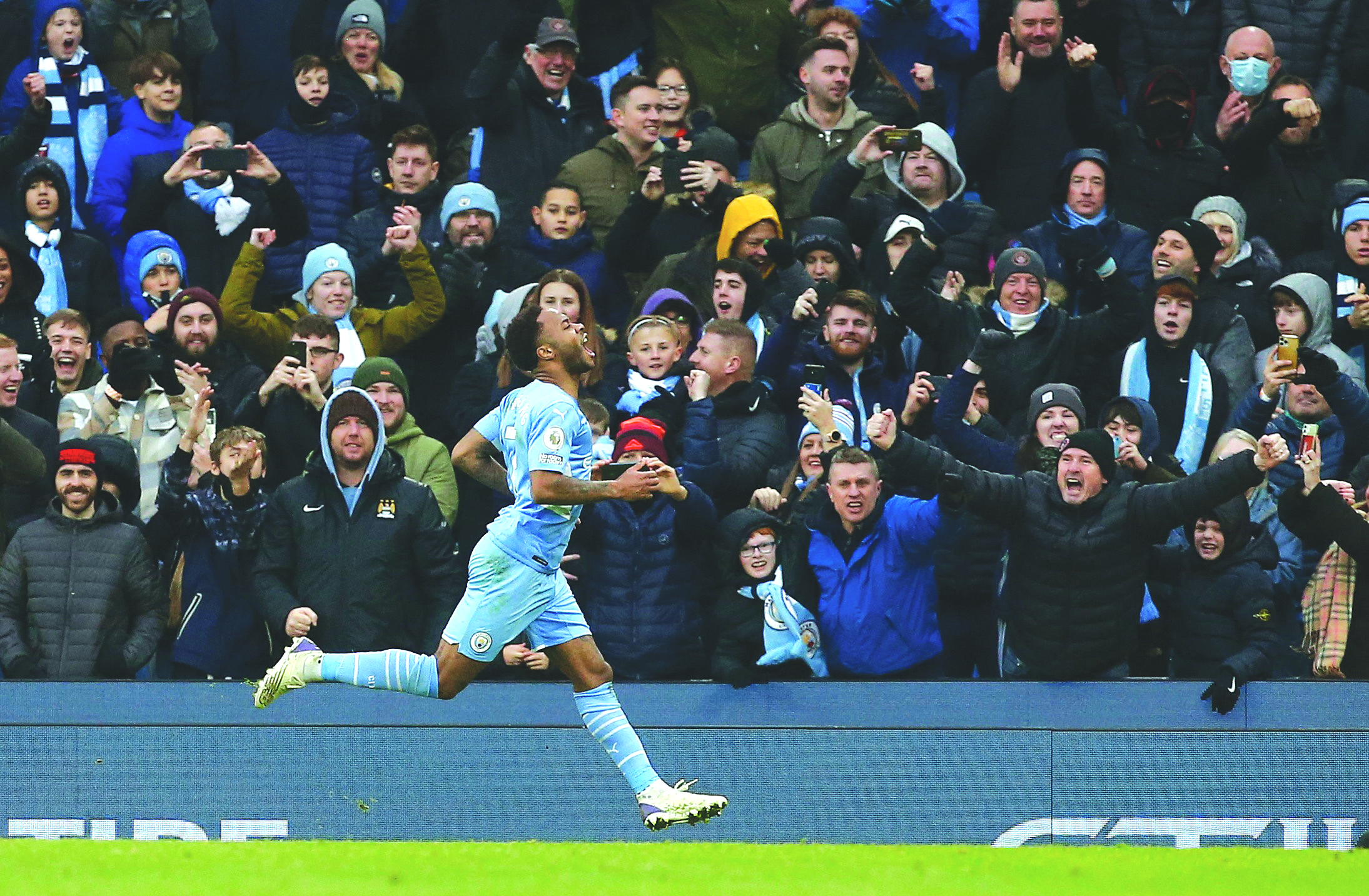 cover Sterling penalty earns leaders Man City win over 10-man Wolves